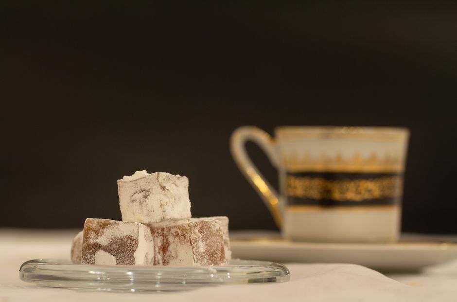 A classic setup of Turkish coffee with traditional lokum (Turkish delight) on a table in Istanbul.